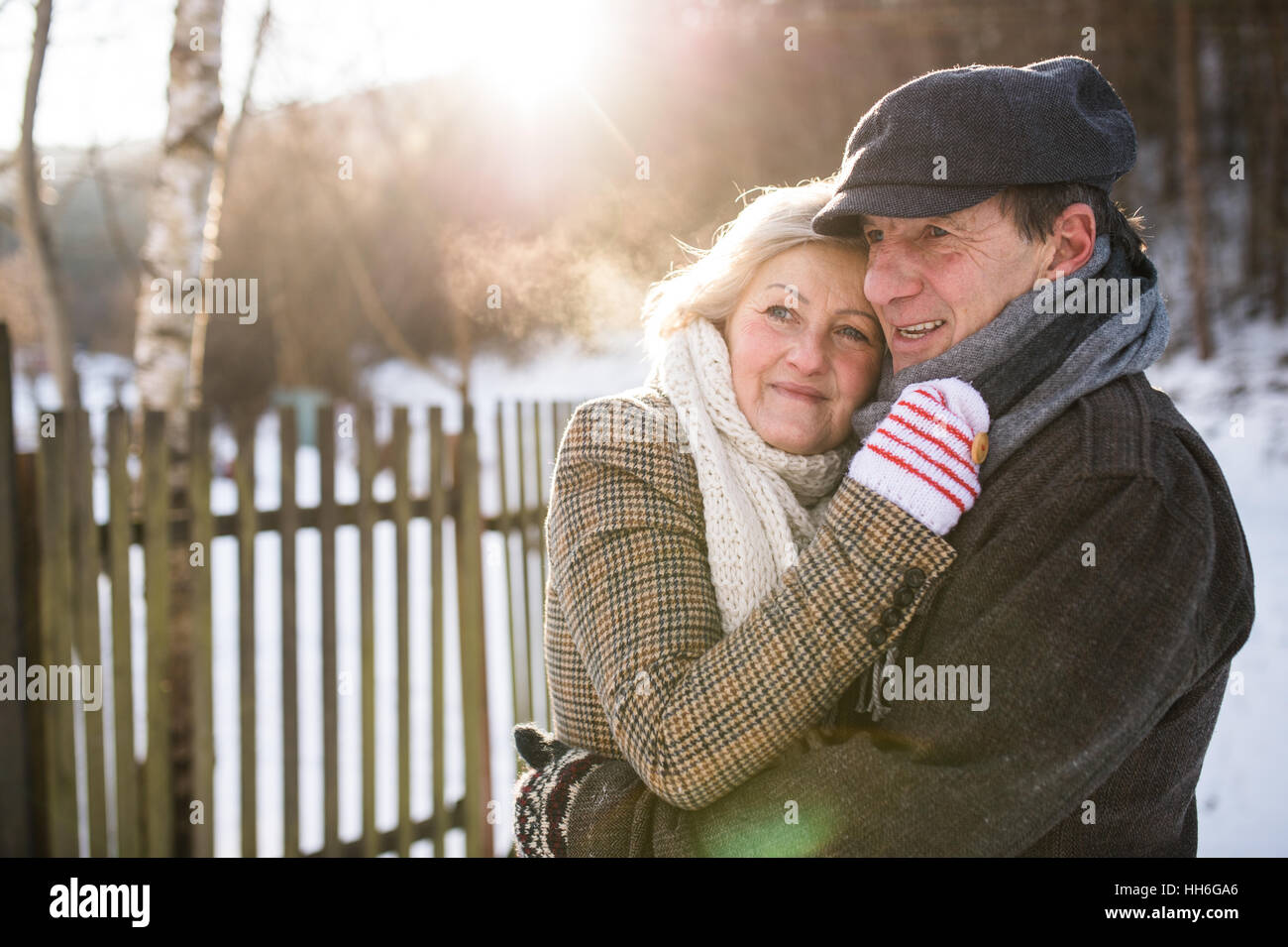 Beautiful senior couple on a walk on sunny winter day Stock Photo