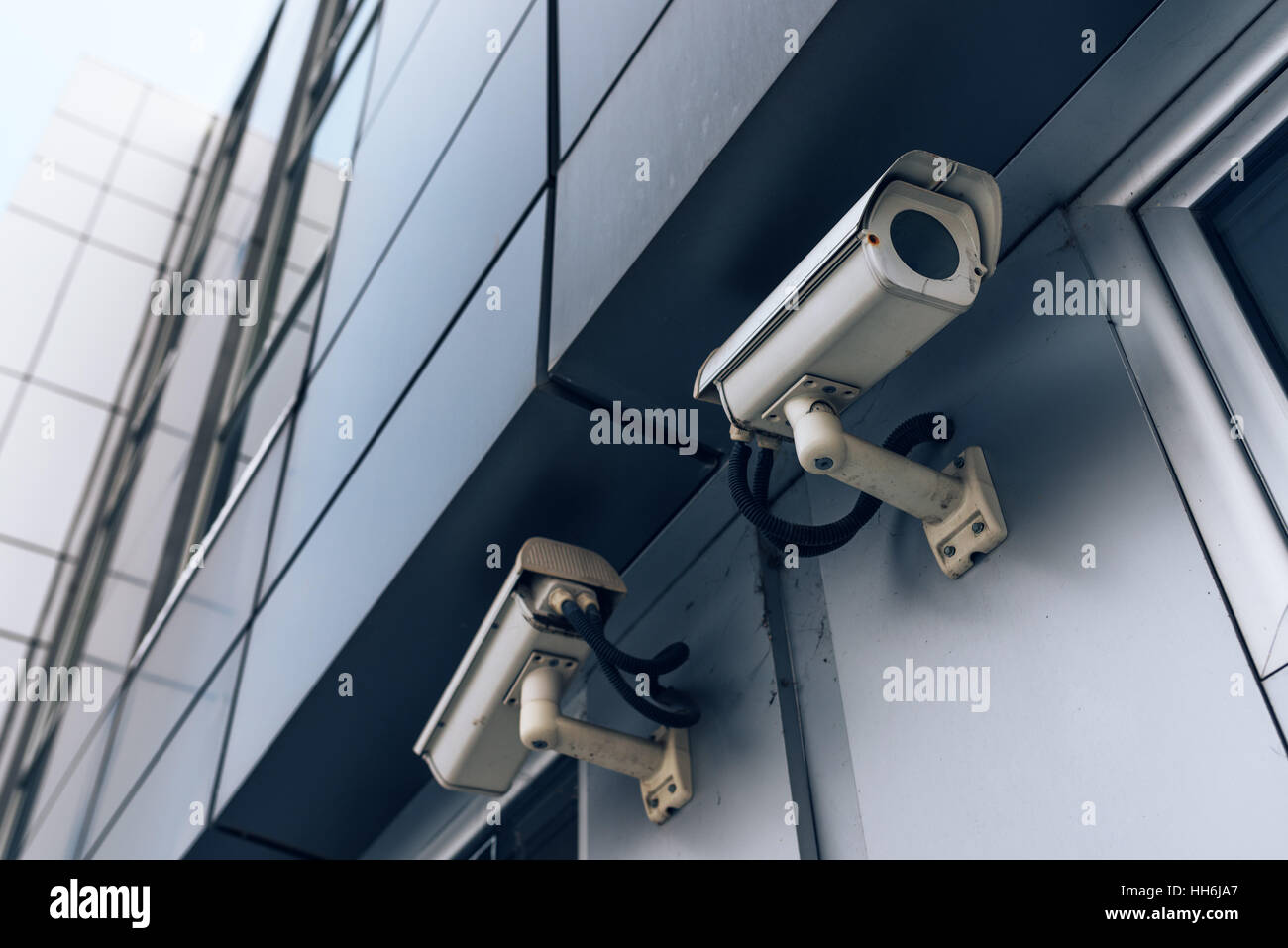Two surveillance cameras on modern building for private property