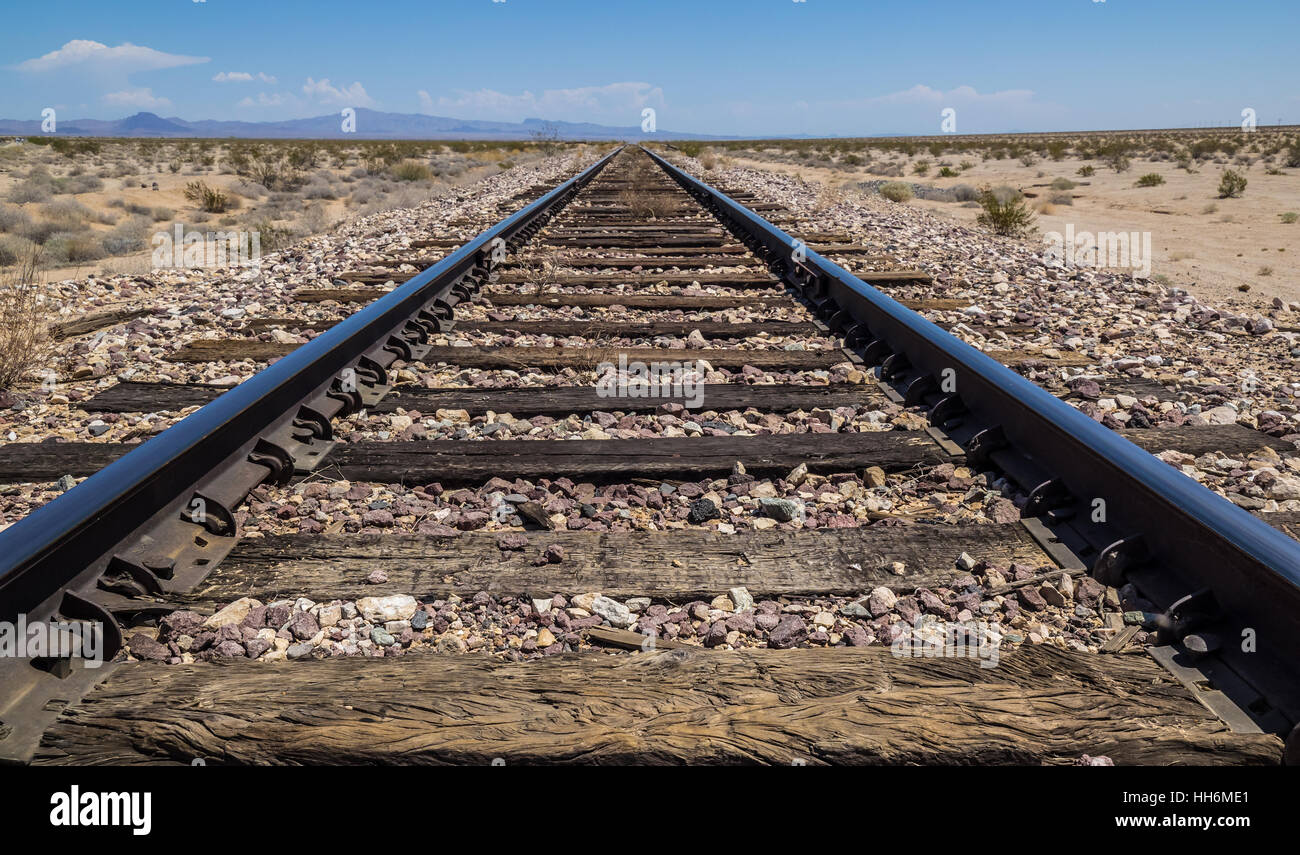 Railway lines converging off into the distance, Californian desert