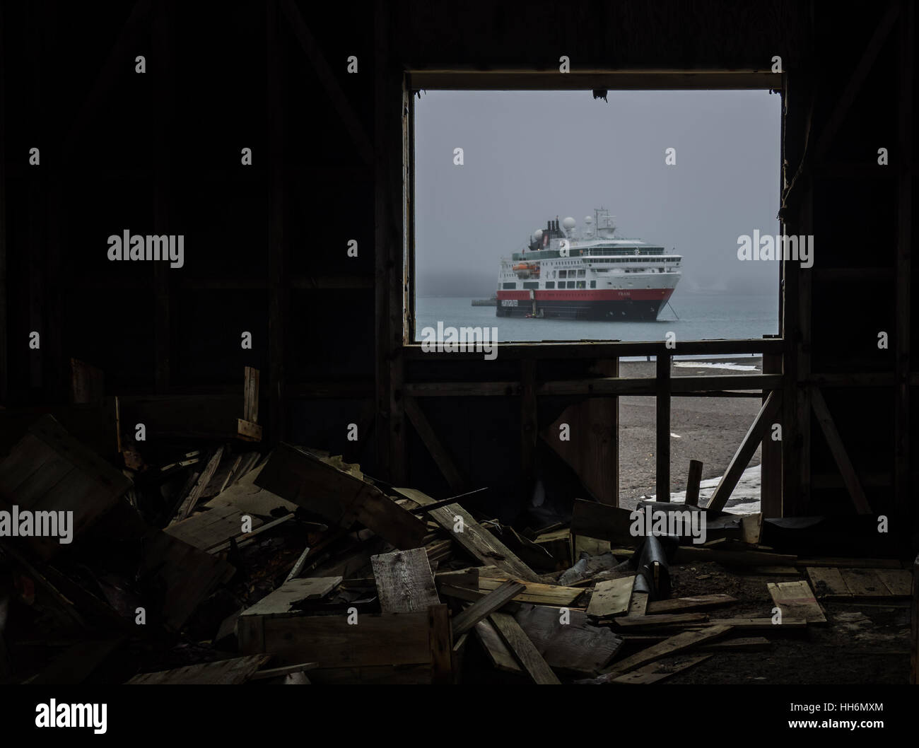 The Hurtigruten cruise ship the MS Fram, as viewed through the window of a derelict hut at Whalers Bay, Deception Island, the Antarctic Peninsula Stock Photo