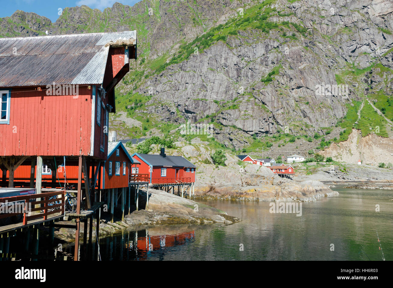 Red rorbu, traditional fishing huts, in the small fishing village of A, Moskenes, Lofoten Islands, Norway, Europe Stock Photo