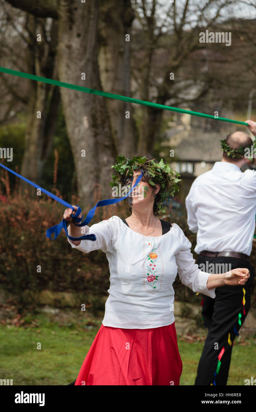 A woman taking part in maypole dancing at the Marsden Cuckoo Festival
