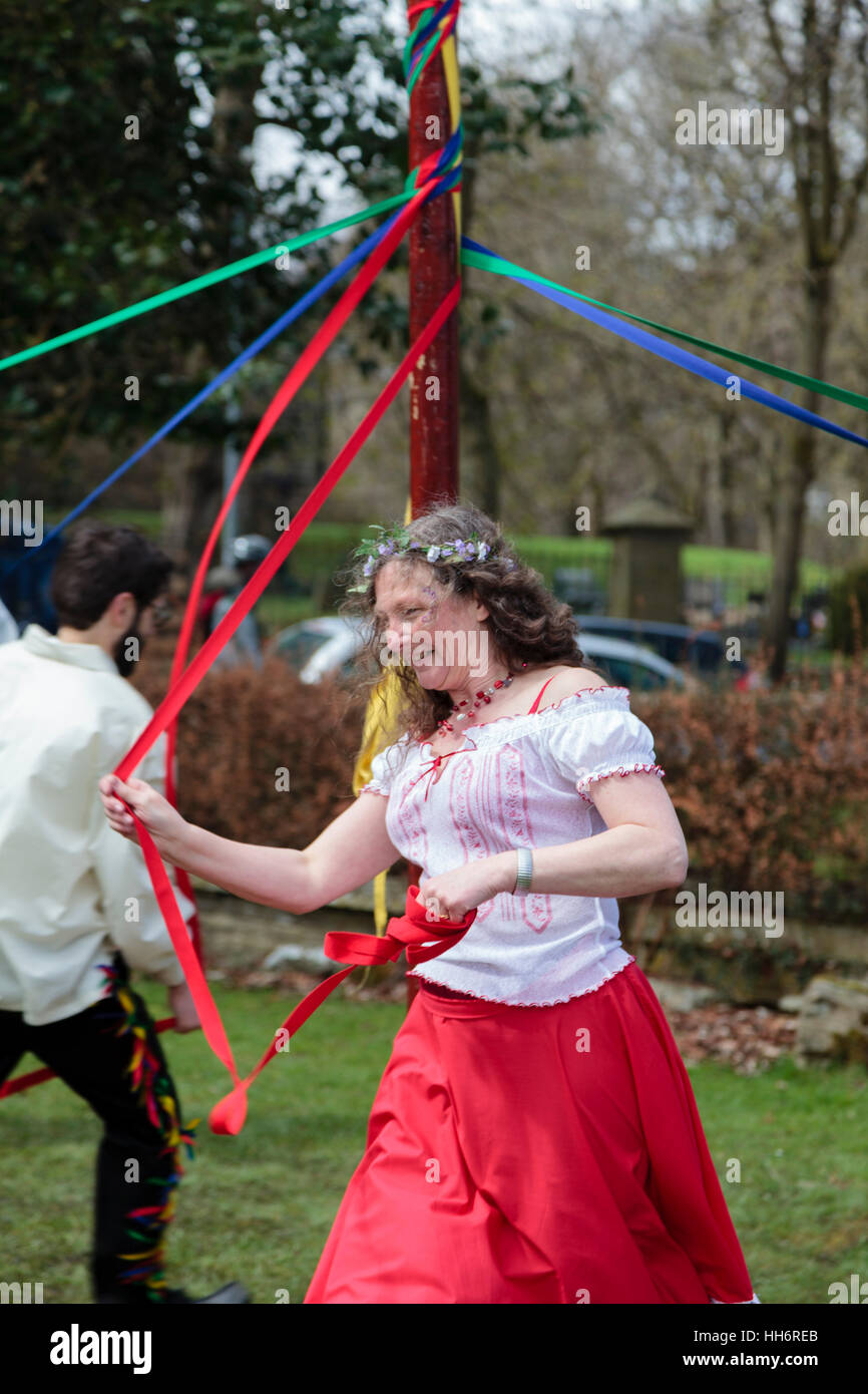 A woman taking part in maypole dancing at the Marsden Cuckoo Festival