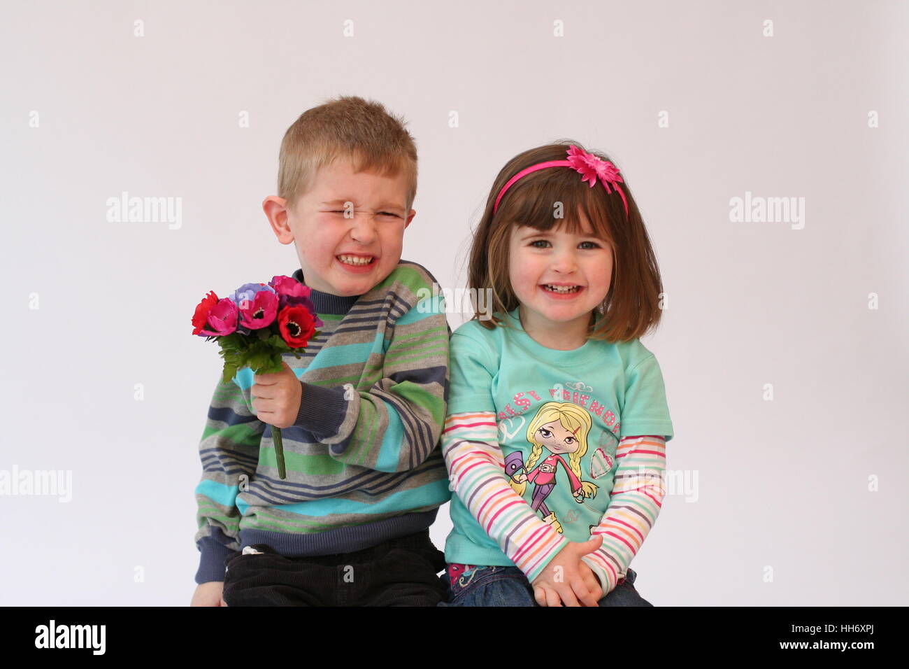 Brother and sister kids children laughing playing and having fun together Stock Photo