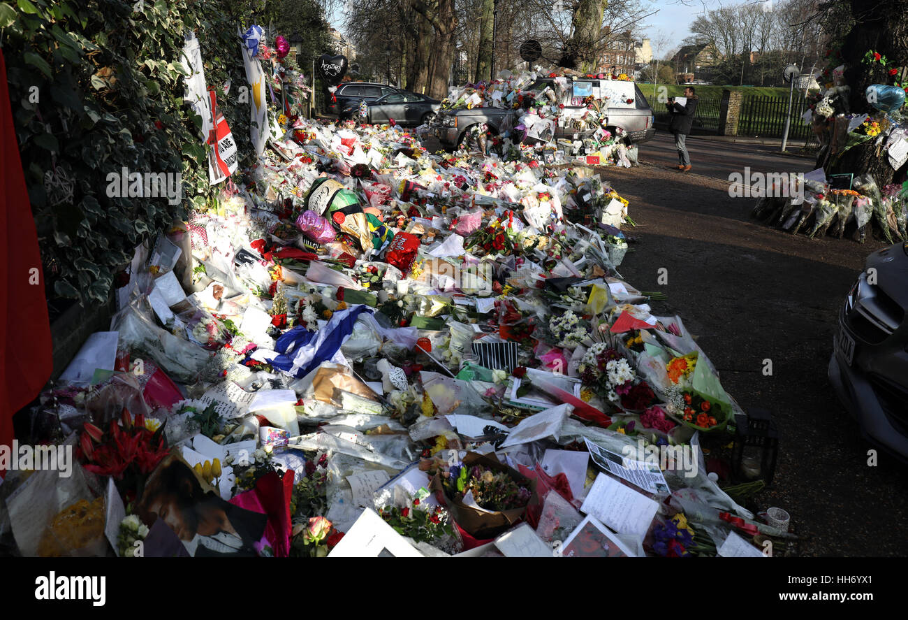 Tributes outside the home of George Michael who died on Christmas day 2016 Flowers  photographs and messages outside his home Stock Photo