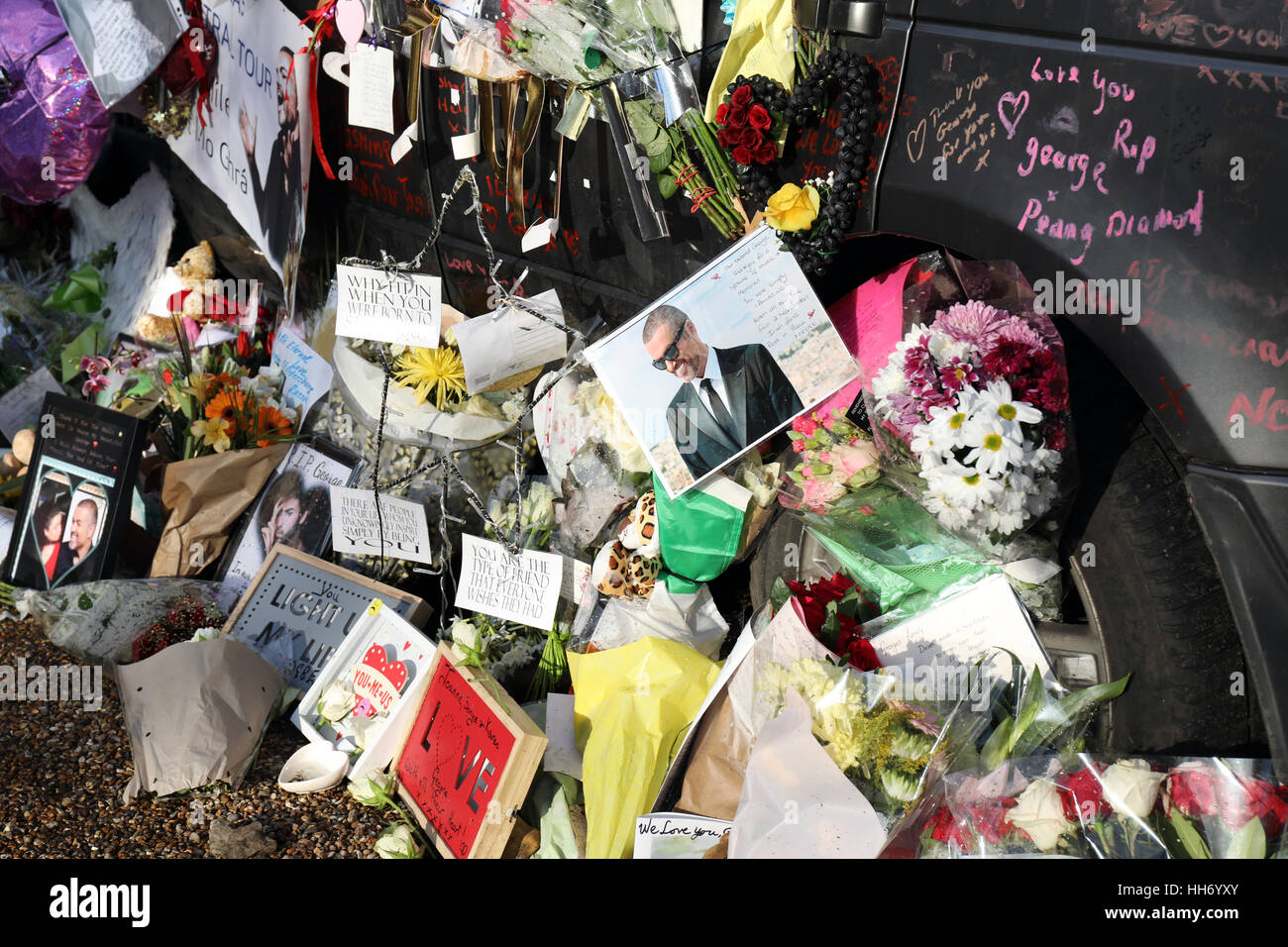 Tributes outside the home of George Michael who died on Christmas day 2016 Flowers  photographs and messages outside his home Stock Photo