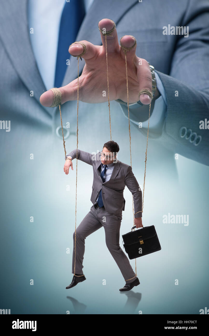 Businessman puppet being manipulated by boss Stock Photo Alamy