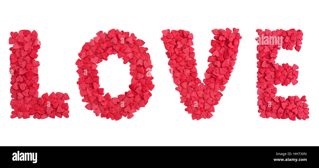 Red caption word love made of small hearts candy sprinkles over white Stock Photo