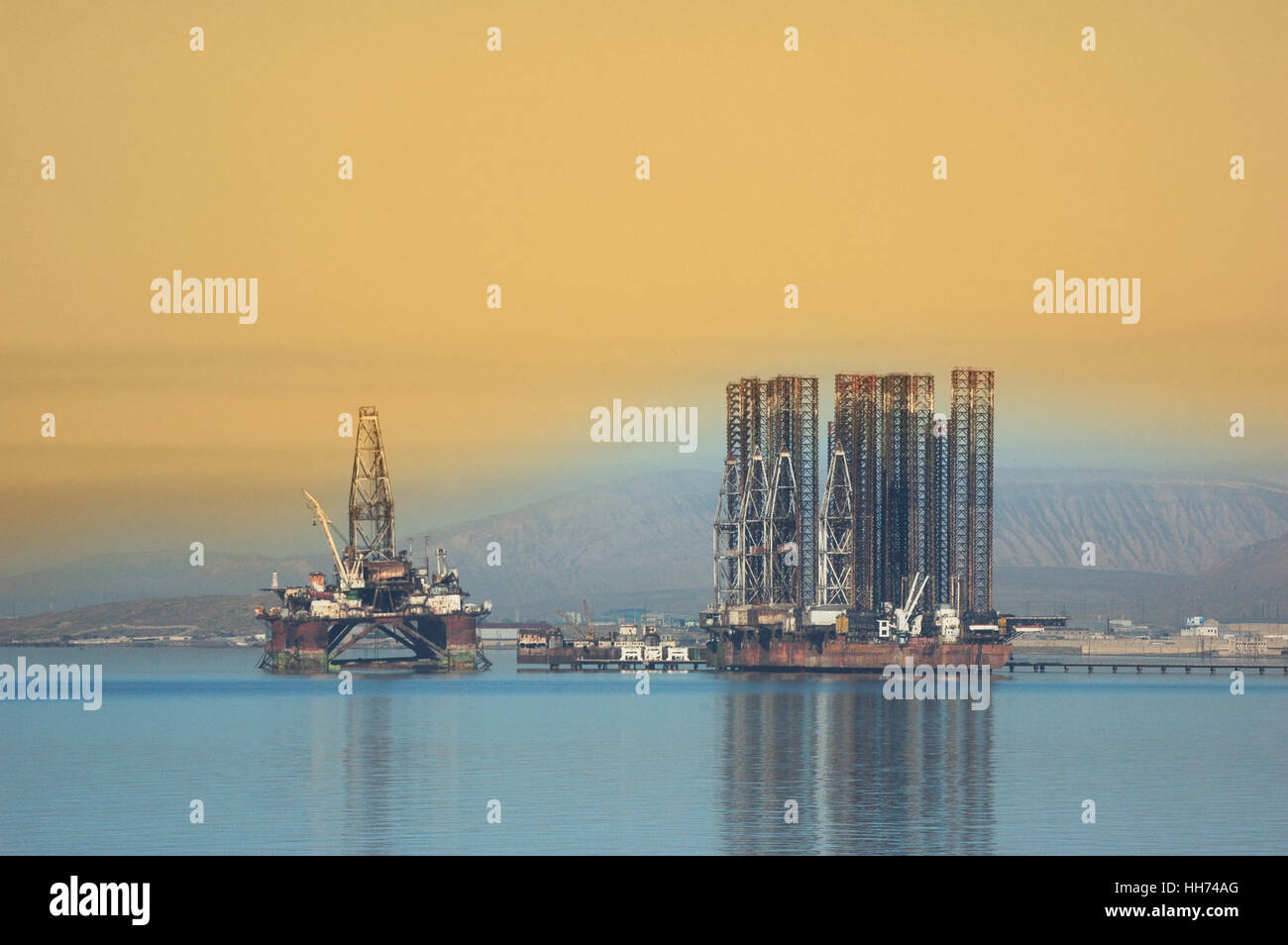 Two offshore rigs at  Caspian shore near Baku Stock Photo