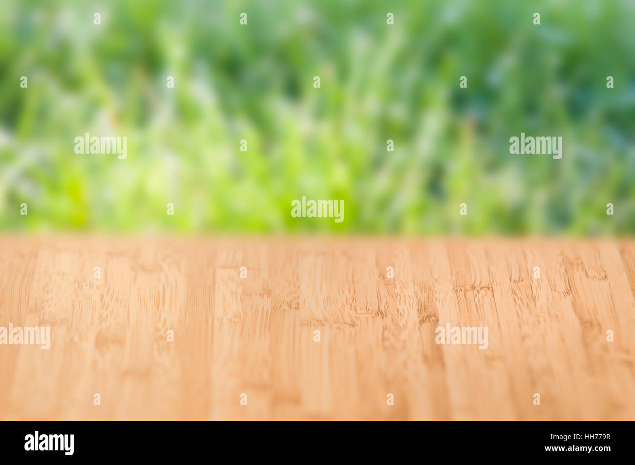 Fresh bright nature background with wooden surface and grass texture Stock Photo