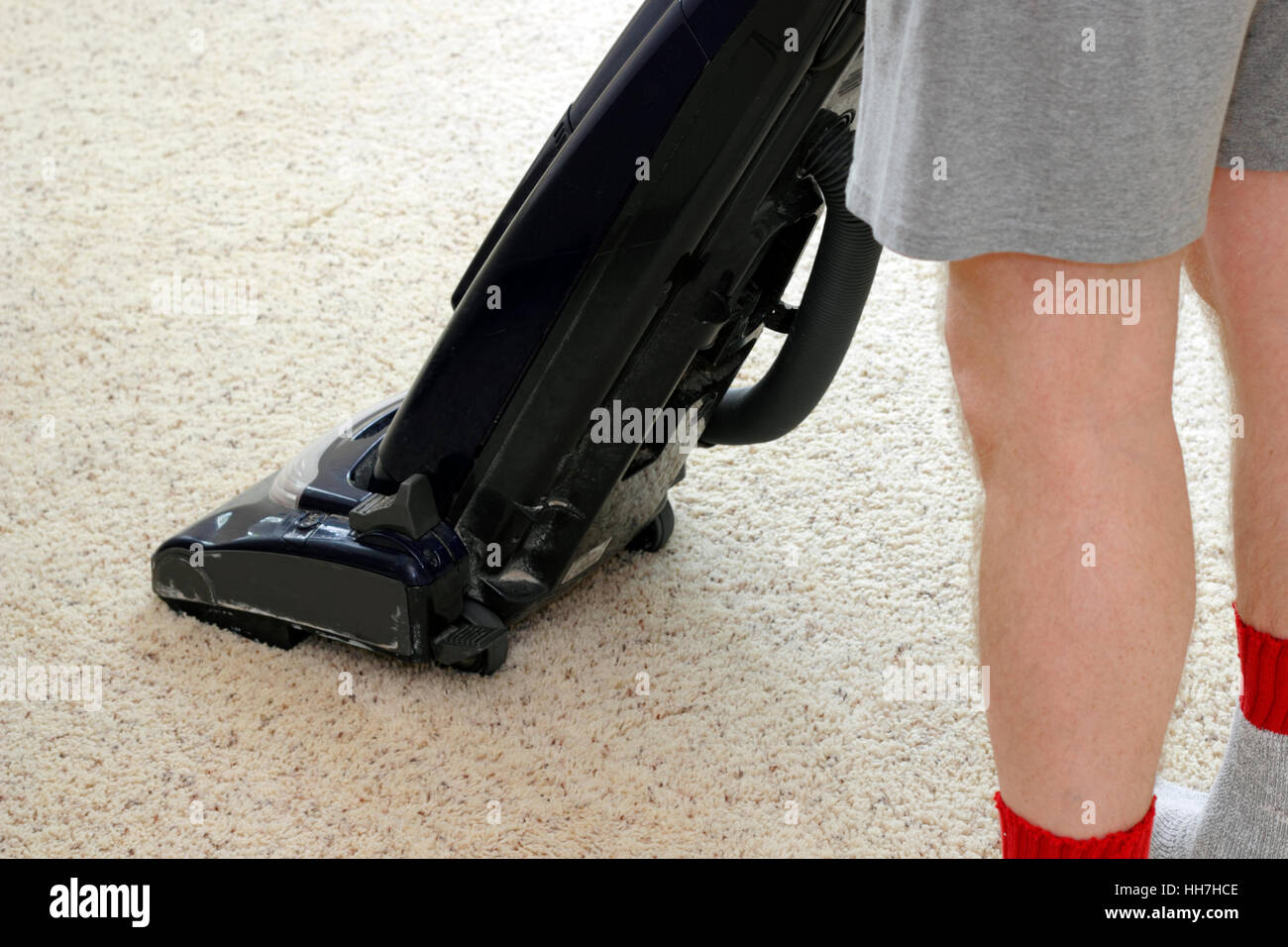 person, carpet, vacuum, cleaning, man, cleansing, legs, blue, humans, human Stock Photo Alamy