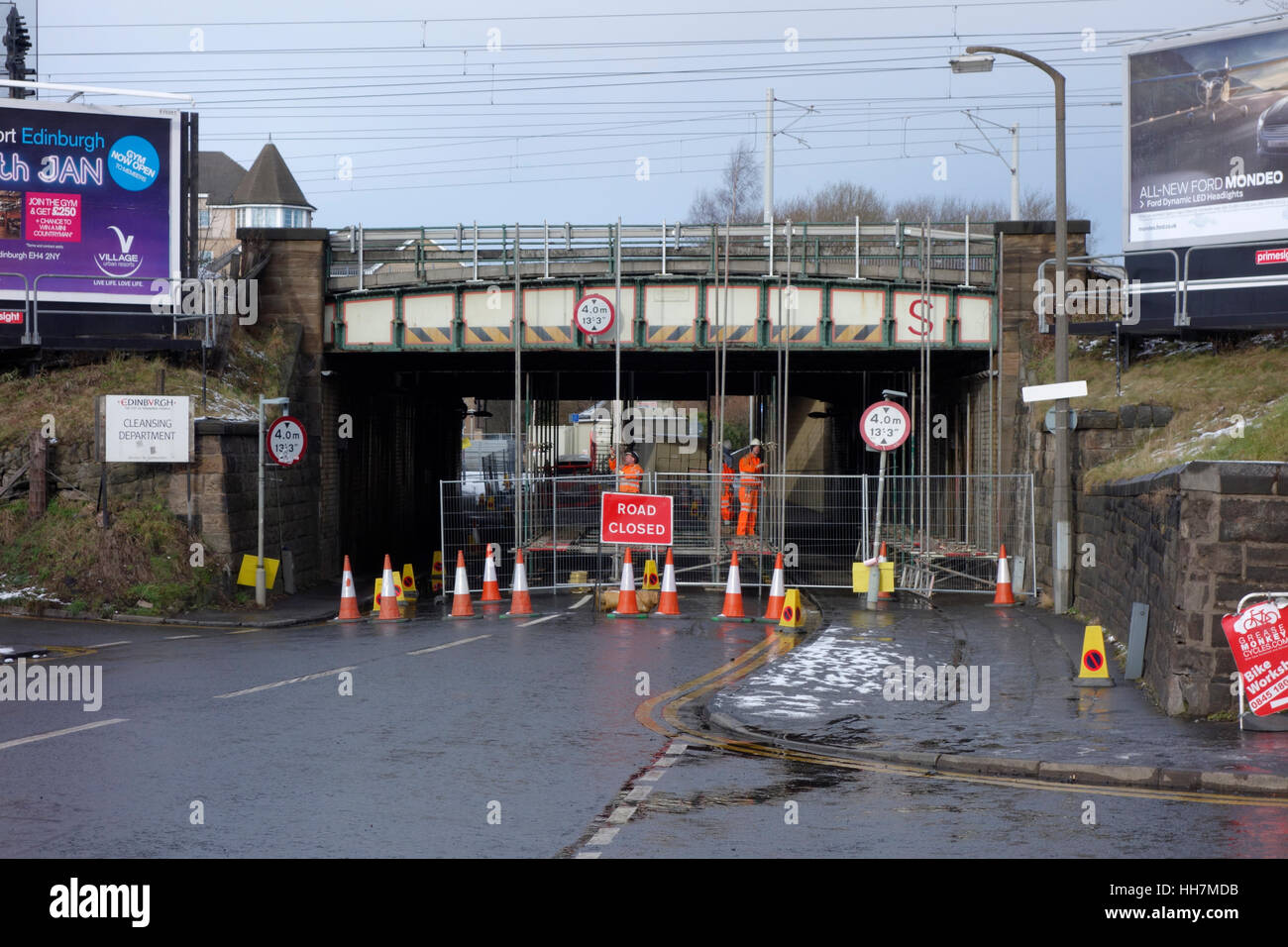 Scaffolders putting up scaffolding in preparation to carrying out maintenance on a railway bridge, Roseburn, Edinburgh Stock Photo