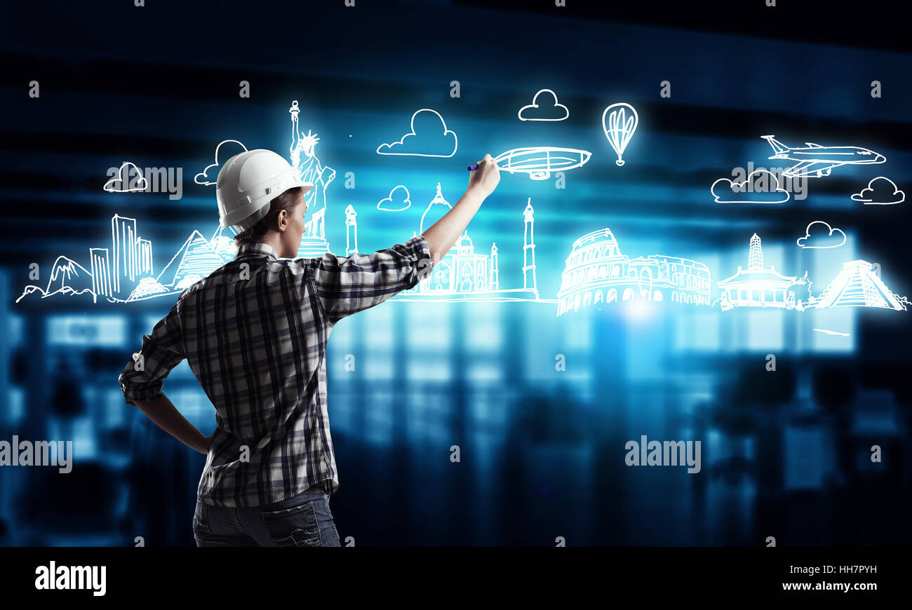 Rear view of engineer woman drawing construction plan Stock Photo - Alamy