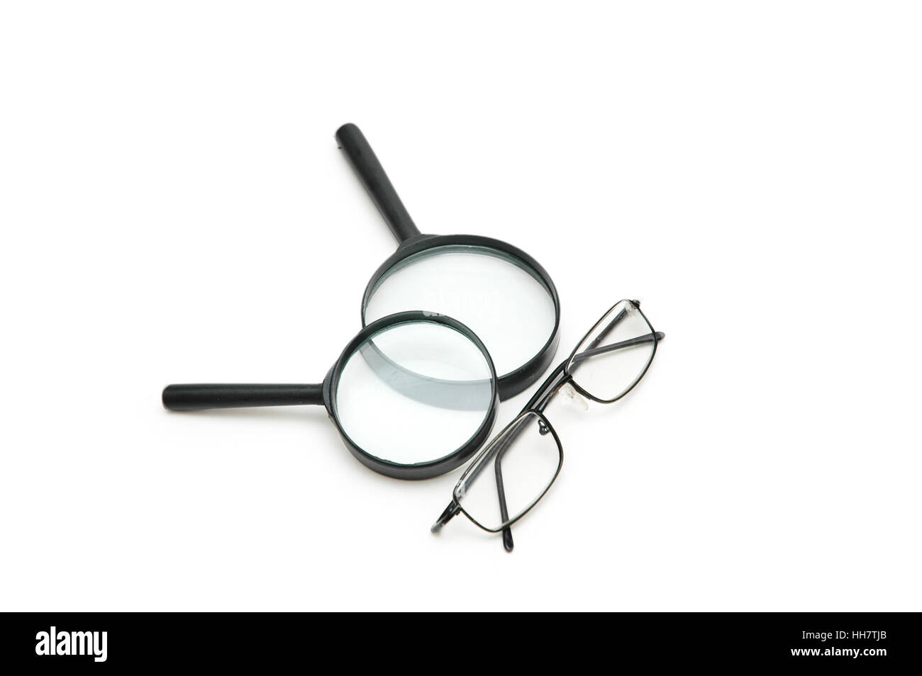 Magnifying glasses and reading glasses isolated on white Stock Photo