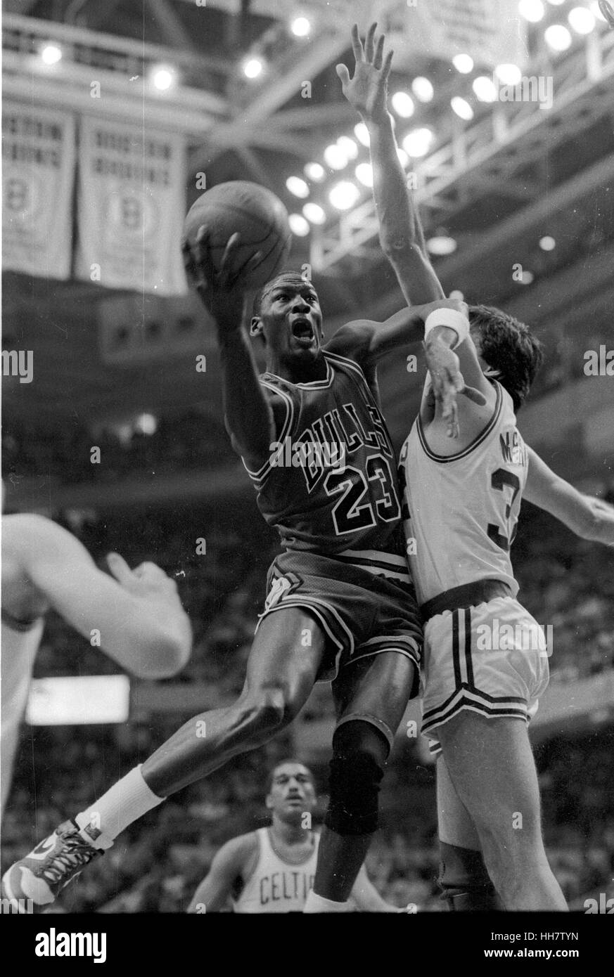 1986 Chicago Bulls Michael Jordan scores past Cetics Kevin McHale at the Boston Garden Stock Photo