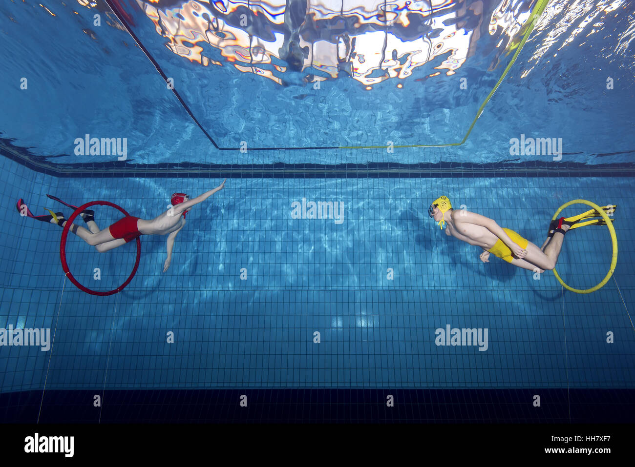 Underwater wrestling (Aquathlon) in swimming pool. Underwater view