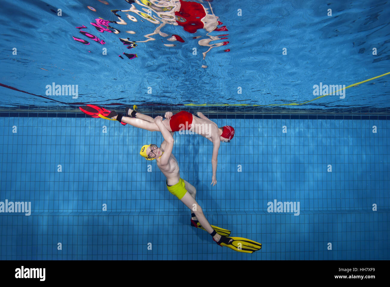 Underwater wrestling (Aquathlon) in swimming pool. Underwater view