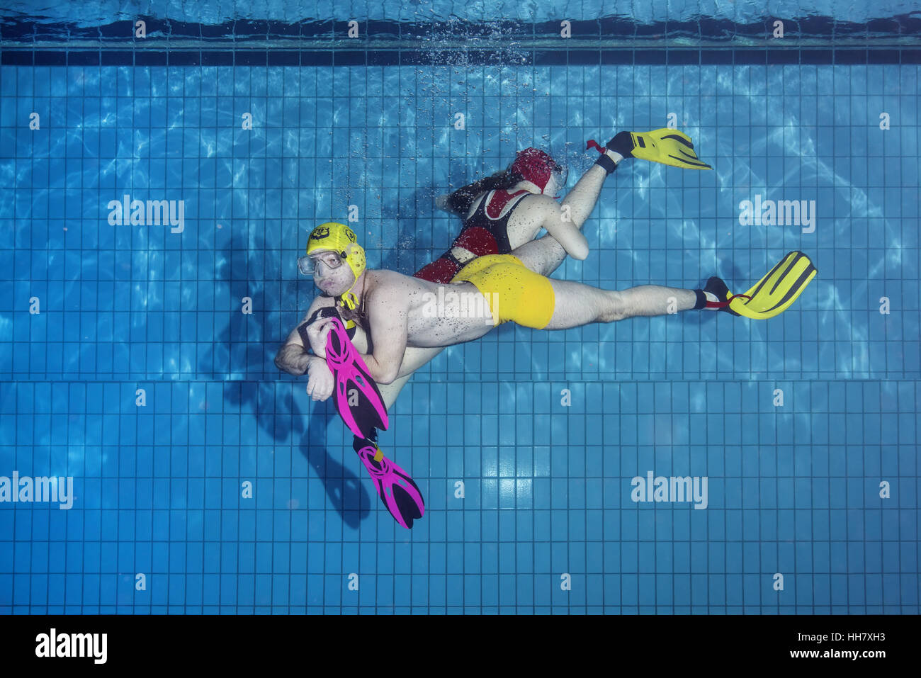Underwater wrestling (Aquathlon) in swimming pool. Underwater view