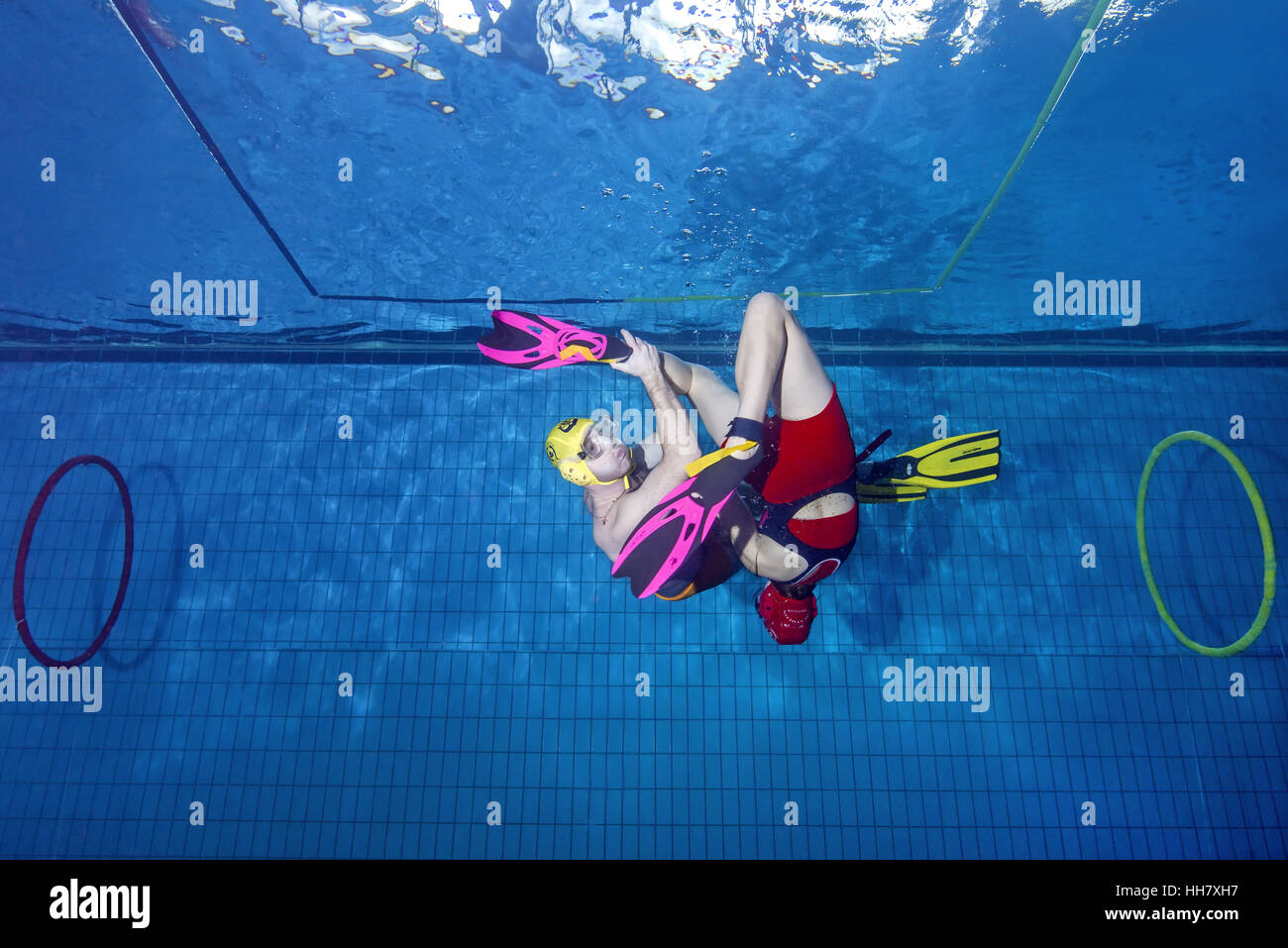 Underwater wrestling (Aquathlon) in swimming pool. Underwater view