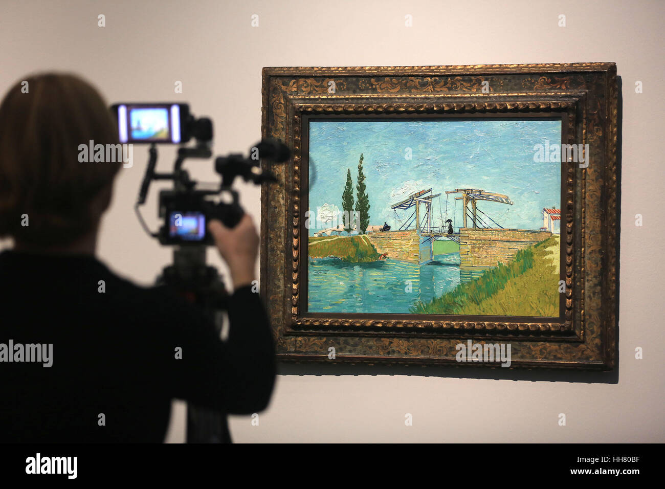 Cologne, Germany. 22nd Sep, 2016. ARCHIVE - An archival image shows a man filming the Dutch expressionist painter Vincent Van Gogh's 'The Railway Bridge' in Cologne, Germany, 22 September 2016. The Wallraf Richartz Museum in Cologne has decided to extend its 'From Duerer to van Gogh' exhibition by two weeks to the 12.02.17 due to its great popularity. Photo: Oliver Berg/dpa/Alamy Live News Stock Photo
