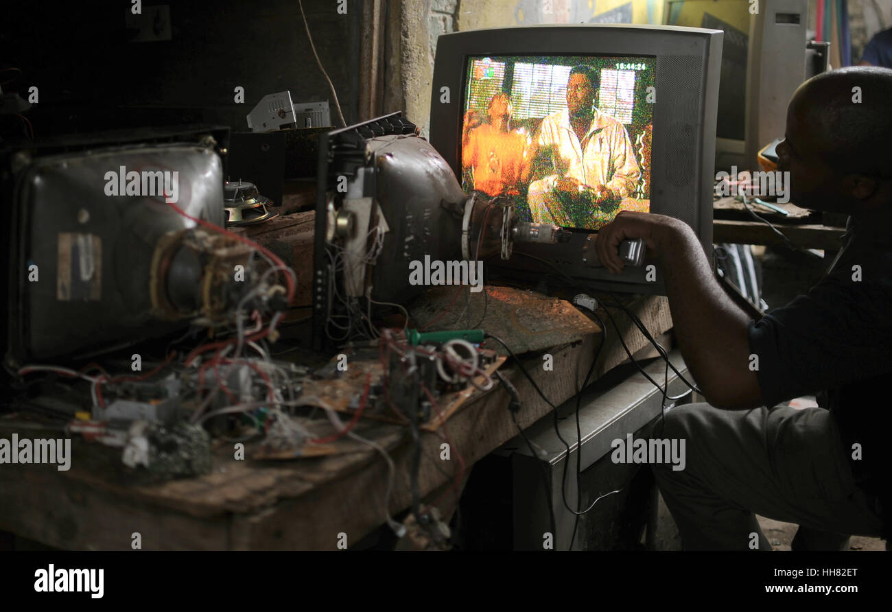 Lusaka, Zambia. 09th Mar, 2016. A man repairs a television inside the Chawama compound in Lusaka, Zambia, 09 March 2016. - NO WIRE SERVICE- Photo: Britta Pedersen/dpa-Zentralbild/ZB/dpa/Alamy Live News Stock Photo