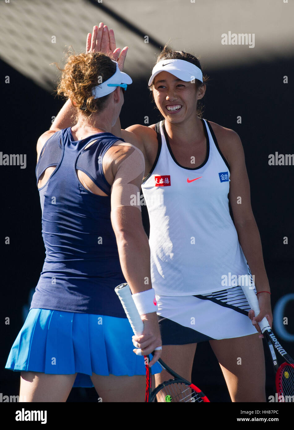 Melbourne, Australia. 18th Jan, 2017. Zhang Shuai(R) of China and Samantha Stosur of Australia celebrate during the women's doubles first round match against Kimberly Birrell and Priscilla Hon of Australia at the Australian Open Tennis Championships in Melbourne, Australia, Jan. 18, 2017. Stosur and Zhang won 2-1. Credit: Bai Xue/Xinhua/Alamy Live News Stock Photo
