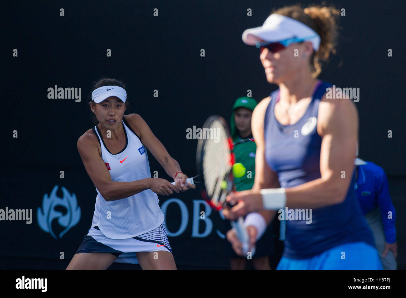 Melbourne, Australia. 18th Jan, 2017. Zhang Shuai (L) of China and Samantha Stosur of Australia compete during the women's doubles first round match against Kimberly Birrell and Priscilla Hon of Australia at the Australian Open Tennis Championships in Melbourne, Australia, Jan. 18, 2017. Stosur and Zhang won 2-1. Credit: Bai Xue/Xinhua/Alamy Live News Stock Photo