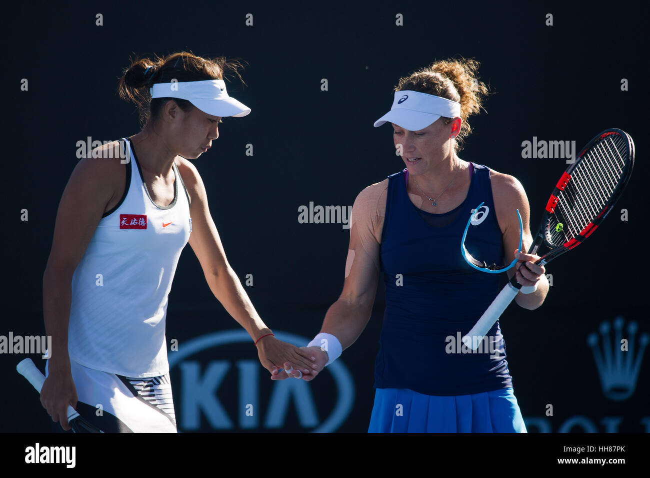 Melbourne, Australia. 18th Jan, 2017. Zhang Shuai (L) of China and Samantha Stosur of Australia take part in the women's doubles first round match against Kimberly Birrell and Priscilla Hon of Australia at the Australian Open Tennis Championships in Melbourne, Australia, Jan. 18, 2017. Stosur and Zhang won 2-1. Credit: Bai Xue/Xinhua/Alamy Live News Stock Photo