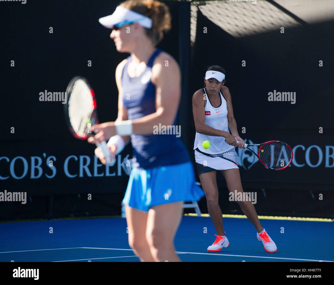 Melbourne, Australia. 18th Jan, 2017. Zhang Shuai (R) of China and Samantha Stosur of Australia compete during the women's doubles first round match against Kimberly Birrell and Priscilla Hon of Australia at the Australian Open Tennis Championships in Melbourne, Australia, Jan. 18, 2017. Stosur and Zhang won 2-1. Credit: Bai Xue/Xinhua/Alamy Live News Stock Photo