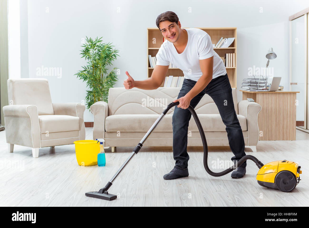 https://c8.alamy.com/comp/HH8FXM/man-husband-cleaning-the-house-helping-wife-HH8FXM.jpg