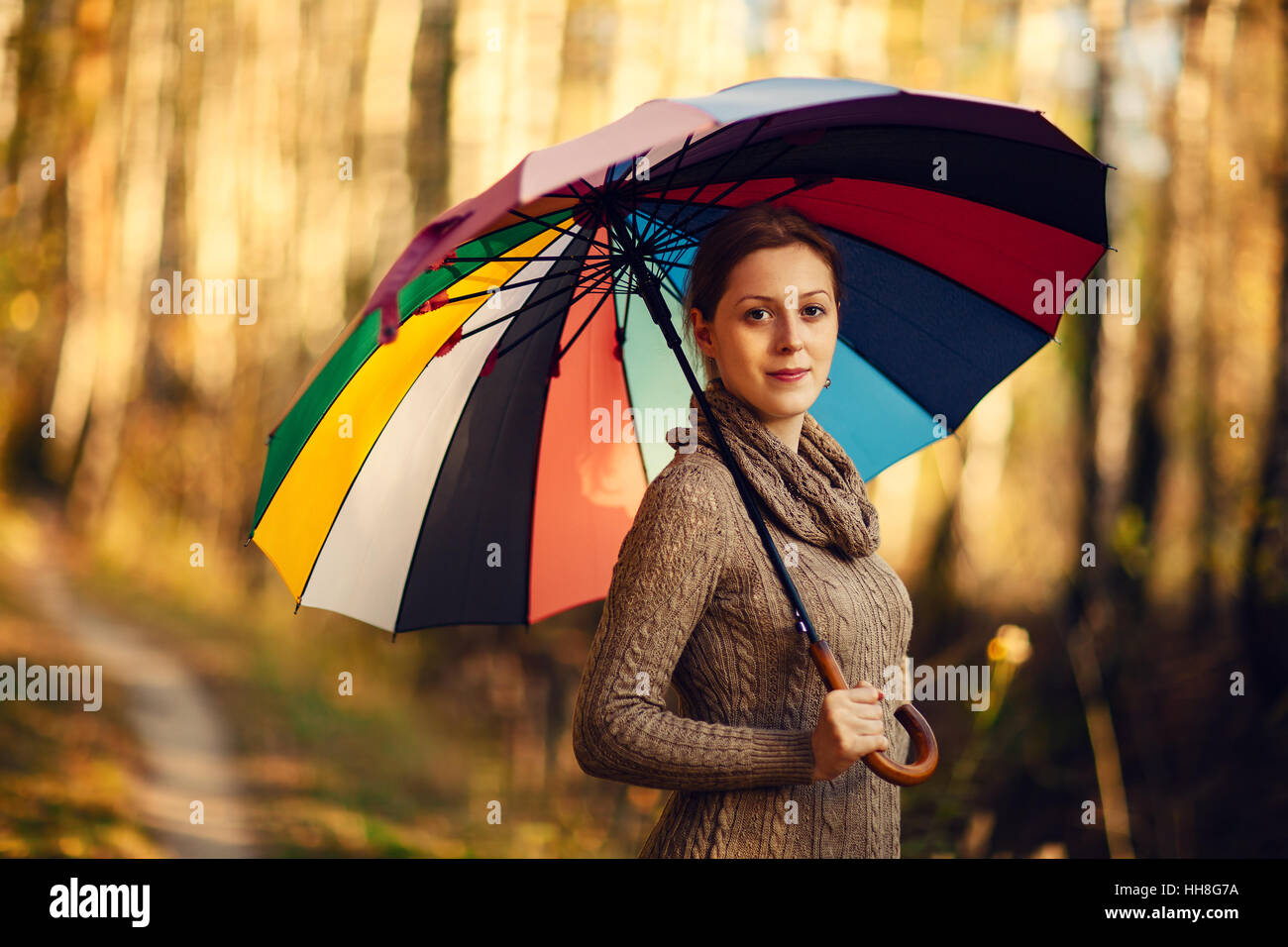 Young woman autumn portrait with umbrella Stock Photo - Alamy