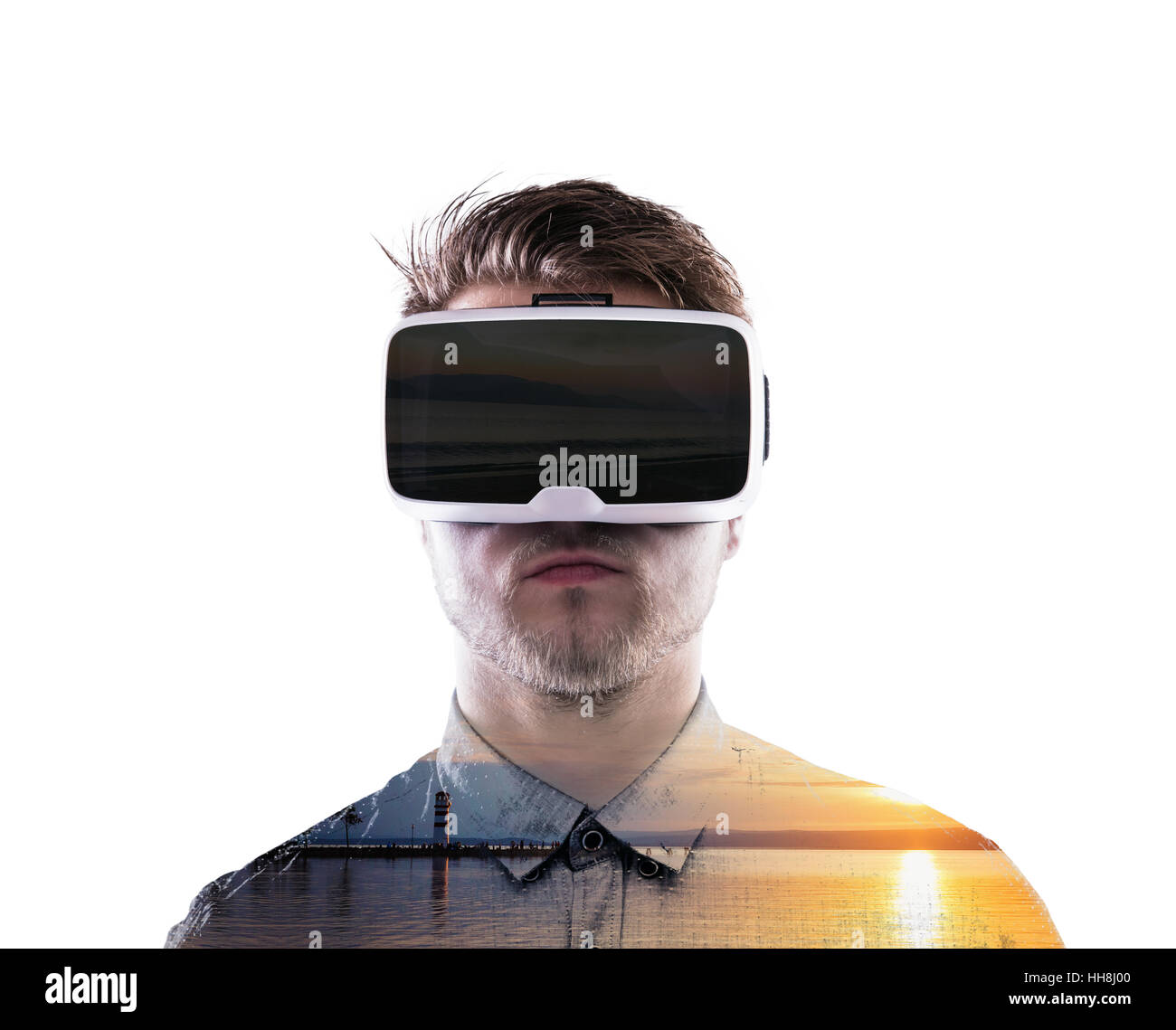 Double exposure. Man wearing virtual reality goggles. Sea at sunset ...