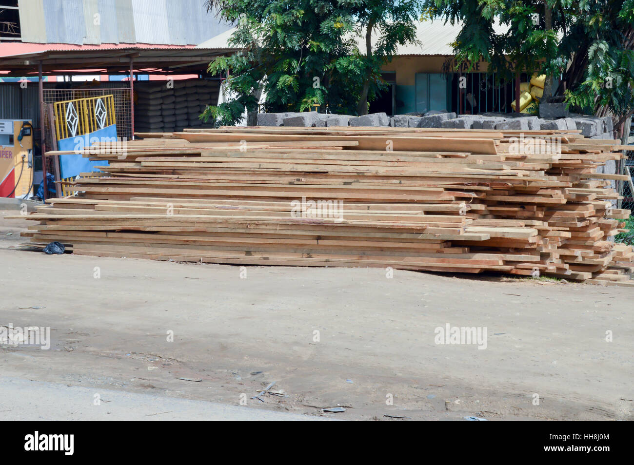 Mound of planed planks waiting to be removed on Mombassa road in Nairobi Stock Photo