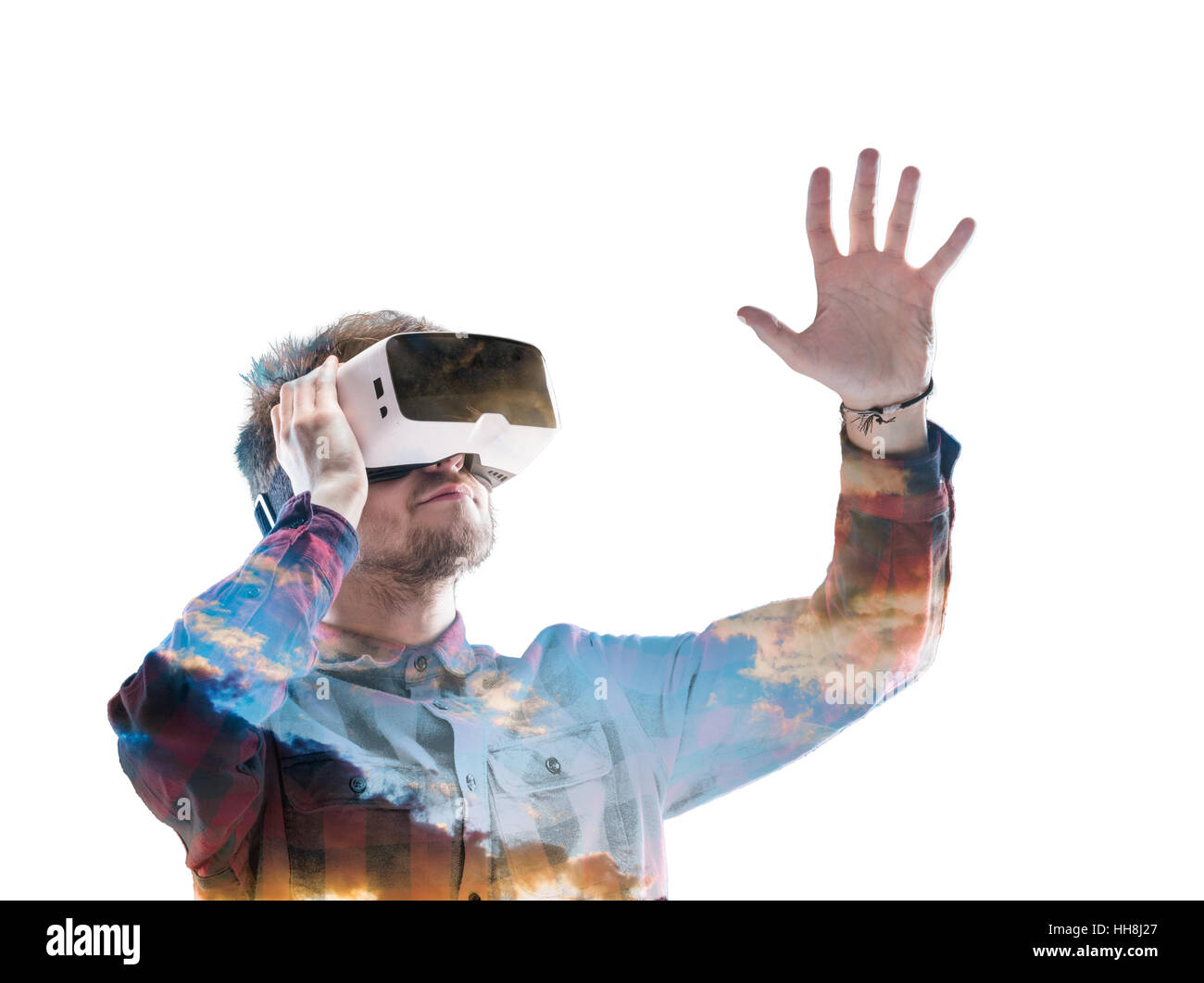 Double exposure. Man wearing virtual reality goggles. Sky Stock Photo ...