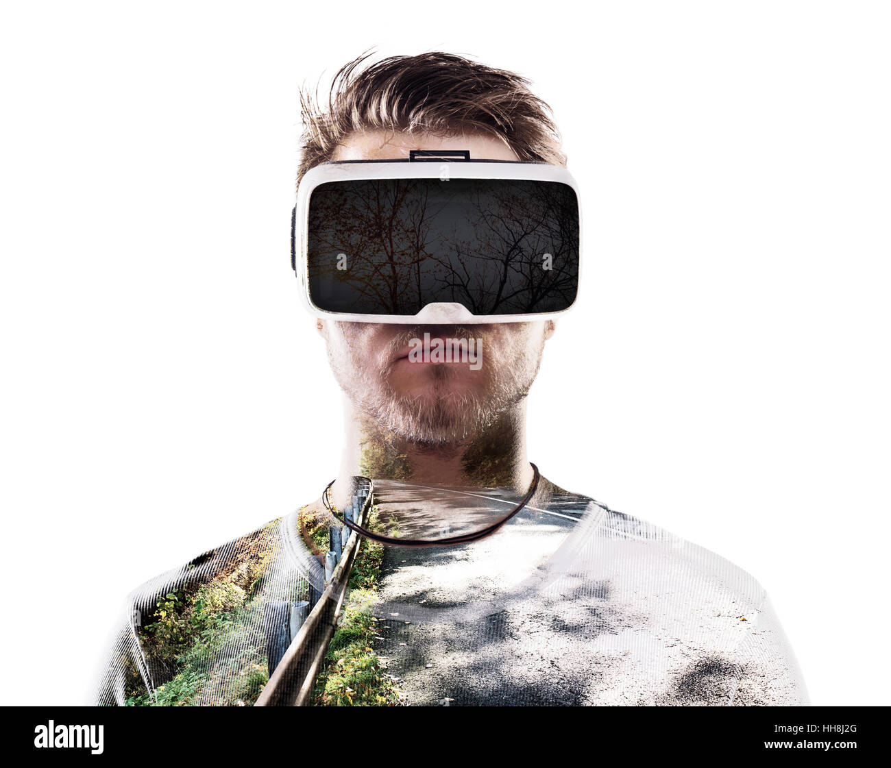 Double exposure. Man wearing virtual reality goggles. Road Stock Photo ...
