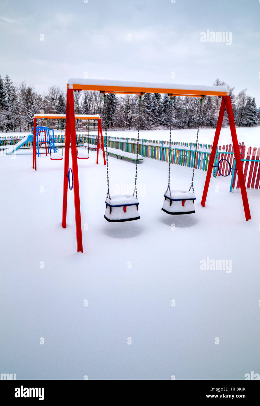Children's playground covered with snow in winter Stock Photo - Alamy