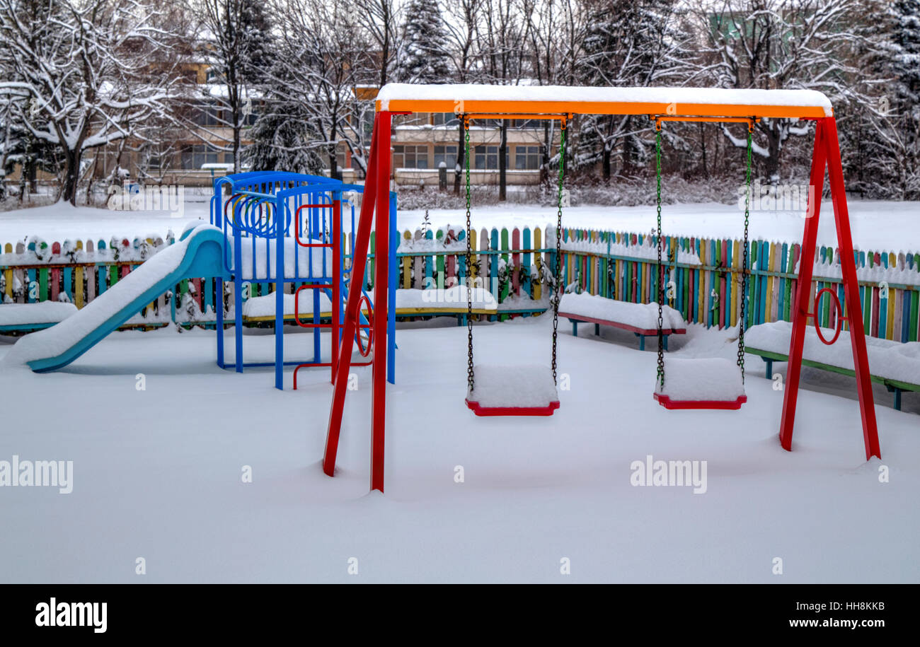Children's playground covered with snow in winter Stock Photo - Alamy
