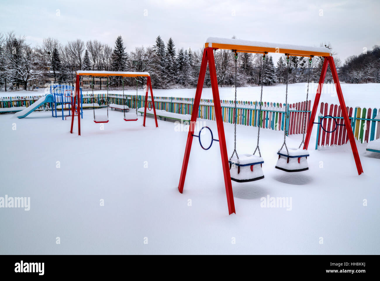 Children's playground covered with snow in winter Stock Photo - Alamy