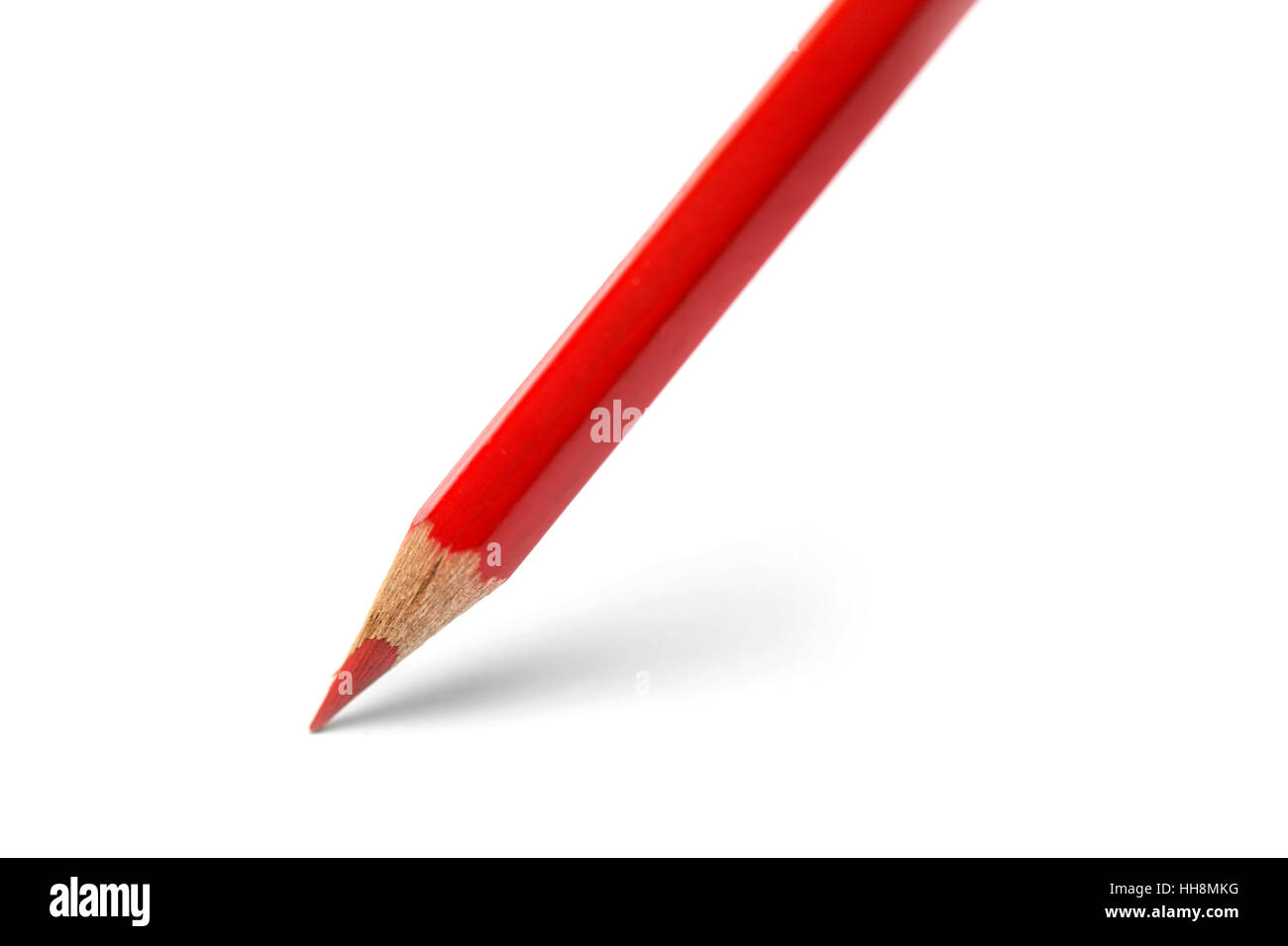 Red color pencil on the white paper Stock Photo