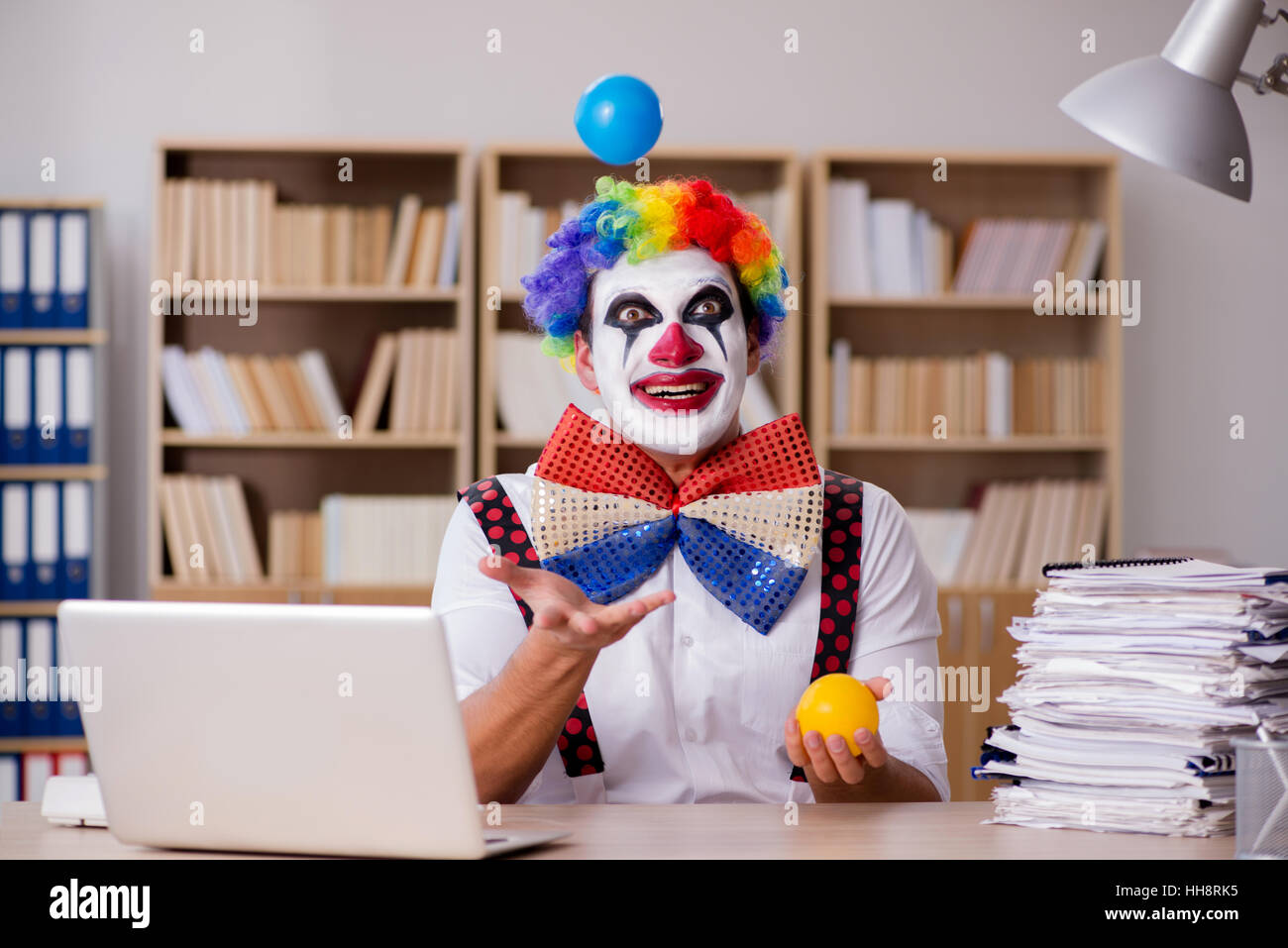 Work Cloan Clown businessman working in the office Stock Photo - Alamy