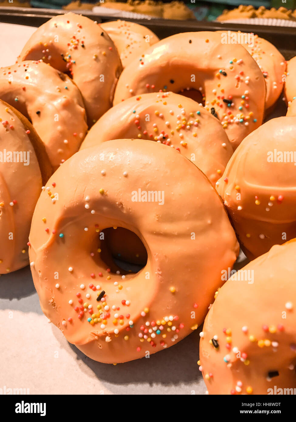 Donuts with sprinkles in the food market Stock Photo Alamy