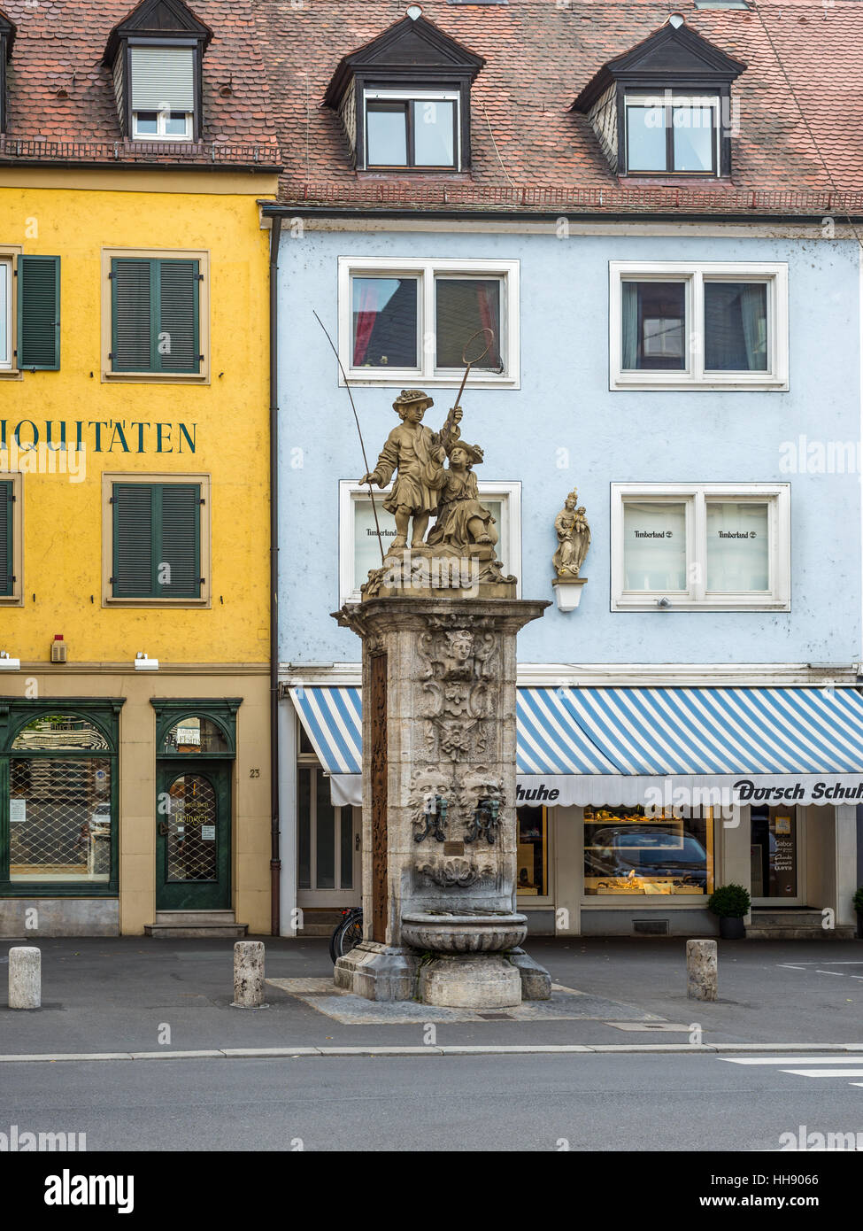 Antecedent software Door Public vintage drinking fountain (water tap) with young fishermen statue on  the street of the old town of Wurzburg Stock Photo - Alamy