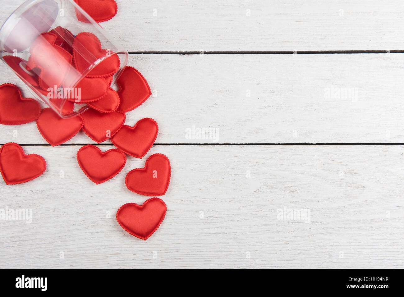 Red hearts on a white wood background Stock Photo - Alamy