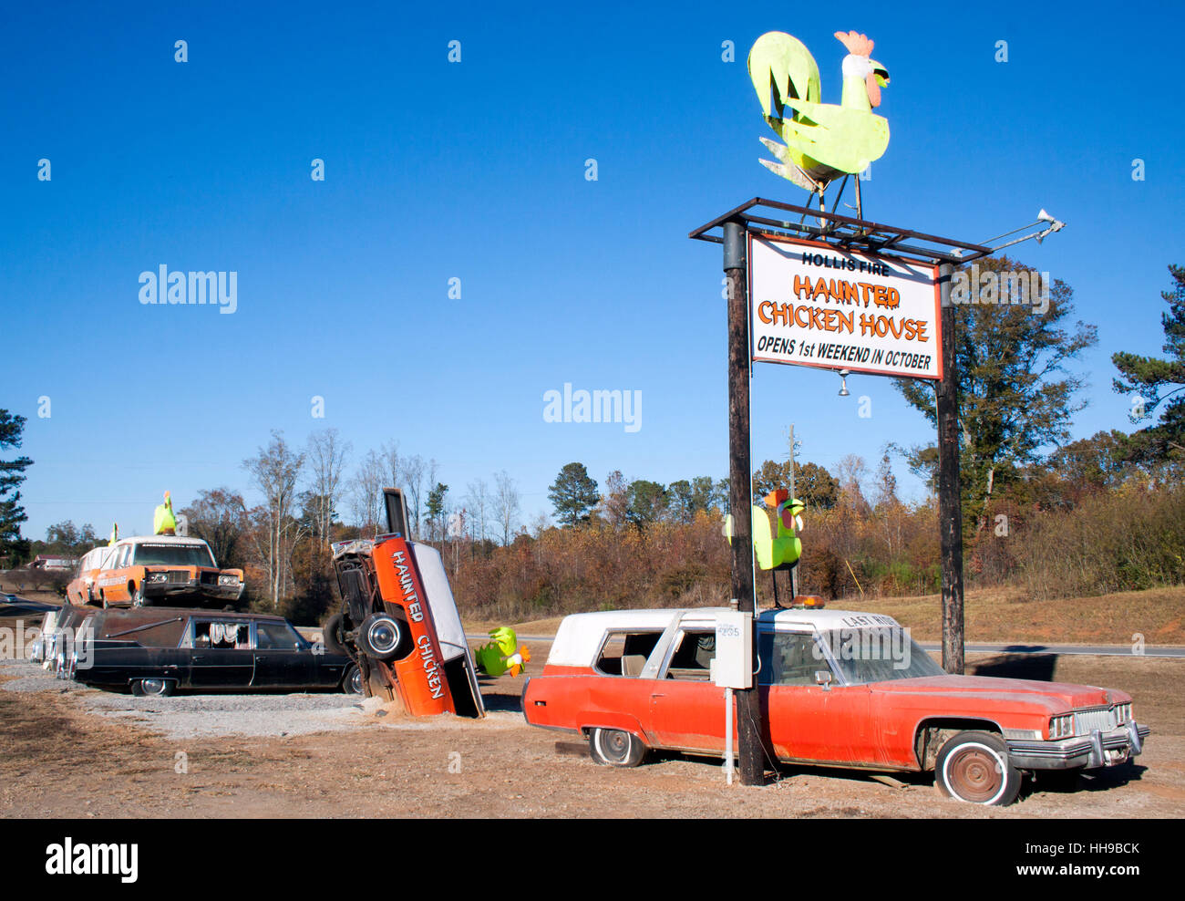 Hearses and Metal Chickens at a haunted house in Heflin Alabama Stock Photo