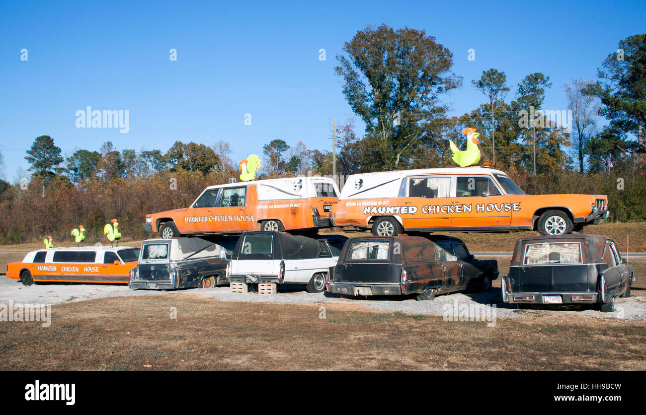 Hearses and Metal Chickens at a haunted house in Heflin Alabama Stock Photo