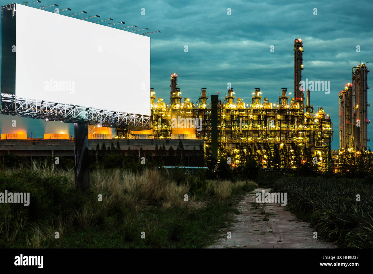 Double exposure of black billboard and electric generating factory in the twilight time can advertisement for display or montage Stock Photo