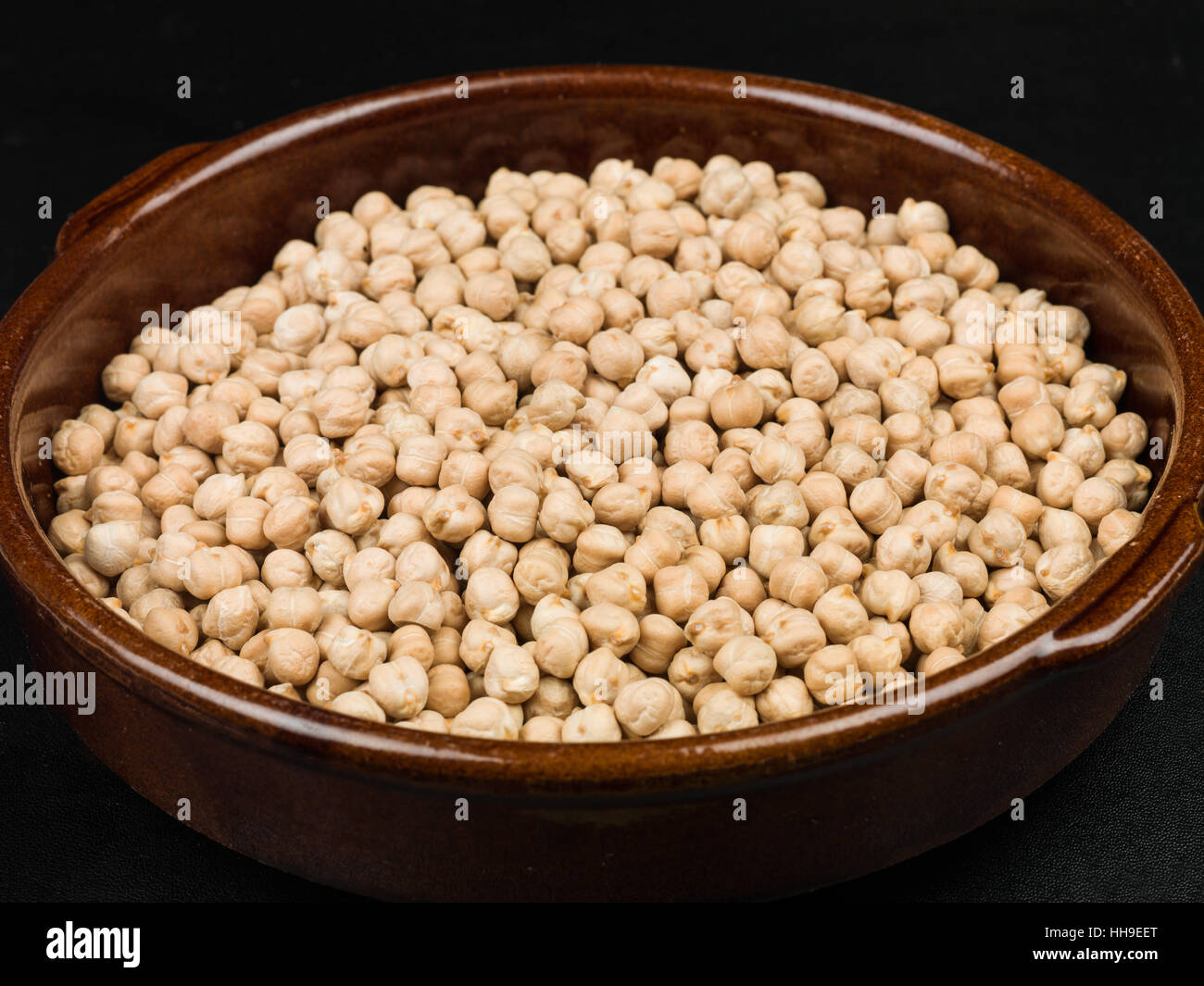 Bowl of Uncooked Chickpeas Cooking Ingredients Stock Photo