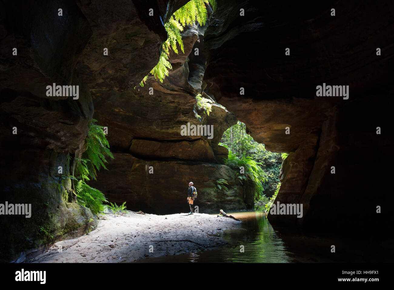 A man standing in the light in Claustral Canyon in the Blue Mountains in Australia Stock Photo