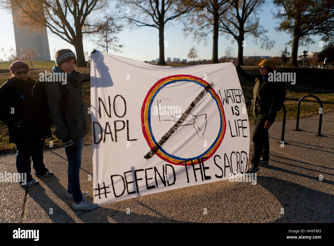 Dakota Access Pipeline protesters holding sign - Washington, DC USA Stock Photo