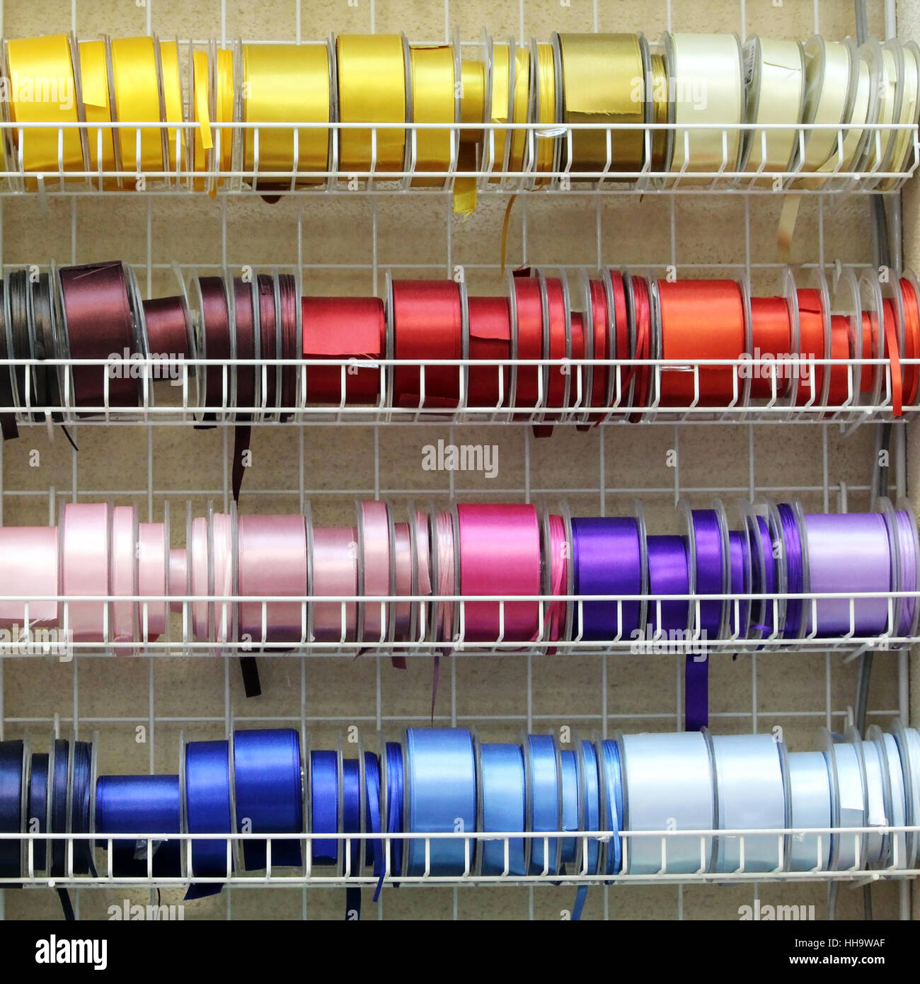 Various colors ribbon bobbins Stock Photo - Alamy